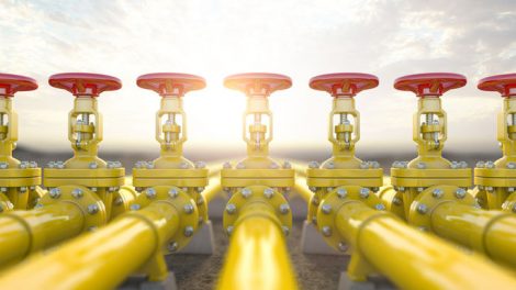Yellow_gas_pipe_line_valves._Oil_and_gas_extraction,_production__and_transportation_industrial_background._3d_illustration