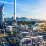 Aerial_view_of_chemical_oil_refinery_plant,_power_plant_on_blue_sky_background.