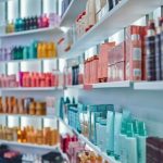 Modern_beauty_salon_interior._Different_cosmetics_on_shelves.