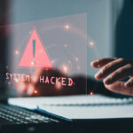System_hacked_alert_after_cyber_attack_on_computer_network._compromised_information_concept._internet_virus_cyber_security_and_cybercrime._hackers_to_steal_the_information_is_a_cybercriminal