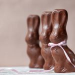 Chocolate_easter_bunny_on_pink_background,_easter_concept_background